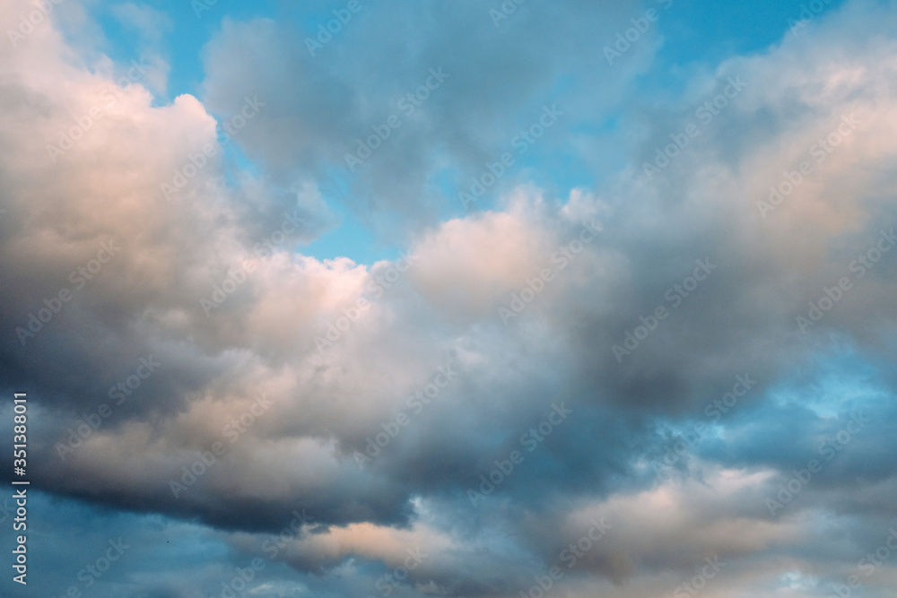 Fototapeta premium Beautiful clouds and blue sky at sunset over the ocean. Beautiful sunset in Tenerife
