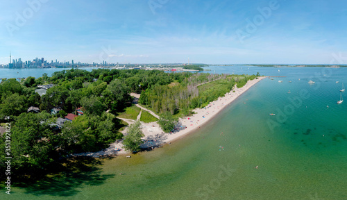Photography Toronto Central Islands and Ward's Island Park beach, Ontario, Canada, aerial view from top at sunny greenery and sandy coast with boats, people swimming at summer