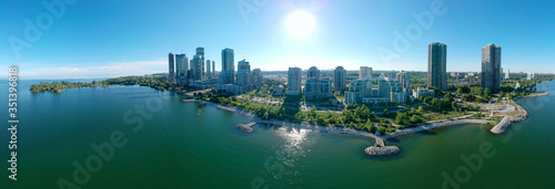 Panorama of Humber Bay Shores Park city view, green space with skyline cityscape downtown. Skyscrapers over The Queensway on sunset at summer time, near Etobicoke or New Toronto, Ontario, Canada photo