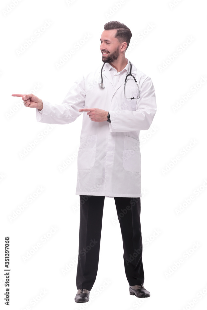 in full growth. smiling therapist doctor pointing to copy space in full growth. smiling therapist doctor pointing to copy space