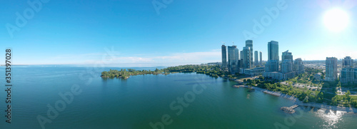 Panorama of Humber Bay Shores Park city view, green space with skyline cityscape downtown. Skyscrapers over The Queensway on sunset at summer time, near Etobicoke or New Toronto, Ontario, Canada