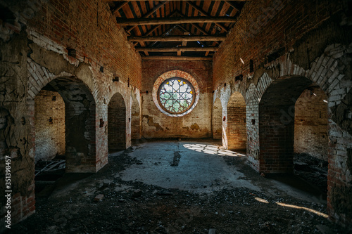 Round stained glass window in old abandoned castle