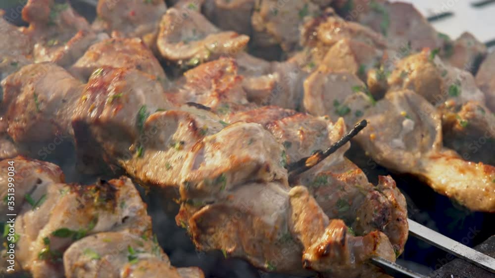 close-up of the process of cooking a barbecue on the grill, Smoking coals and juicy chunks of meat
close-up of the process of cooking a barbecue on the grill, Smoking coals and juicy chunks of meat