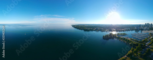 Amazing North American panorama at Humber Bay Shores Park city and green space, skyline cityscape, yacht and boats in azure lake Ontario. Skyscrapers and blue marina, sunset at summer, Ontario, Canada © desertsands