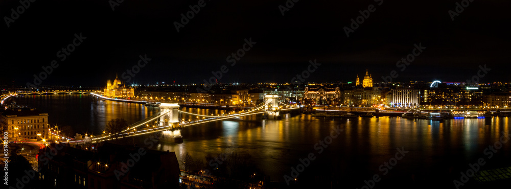views of the European city of Budapest, capital of Hungary, illuminated at night next to the Danube river.