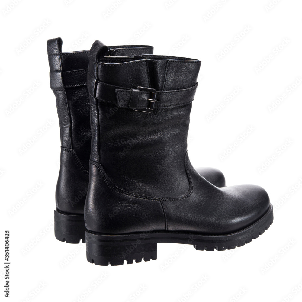 black semi leather female boots, object isolated on white background, clothing accessory black semi leather female boots, object isolated on white background, clothing accessory