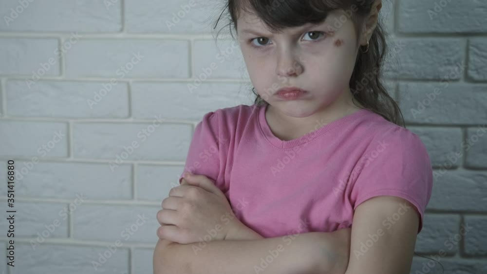 Sad child face in the room. Beaten offended little girl. Sad child face in the room. Beaten offended little girl.