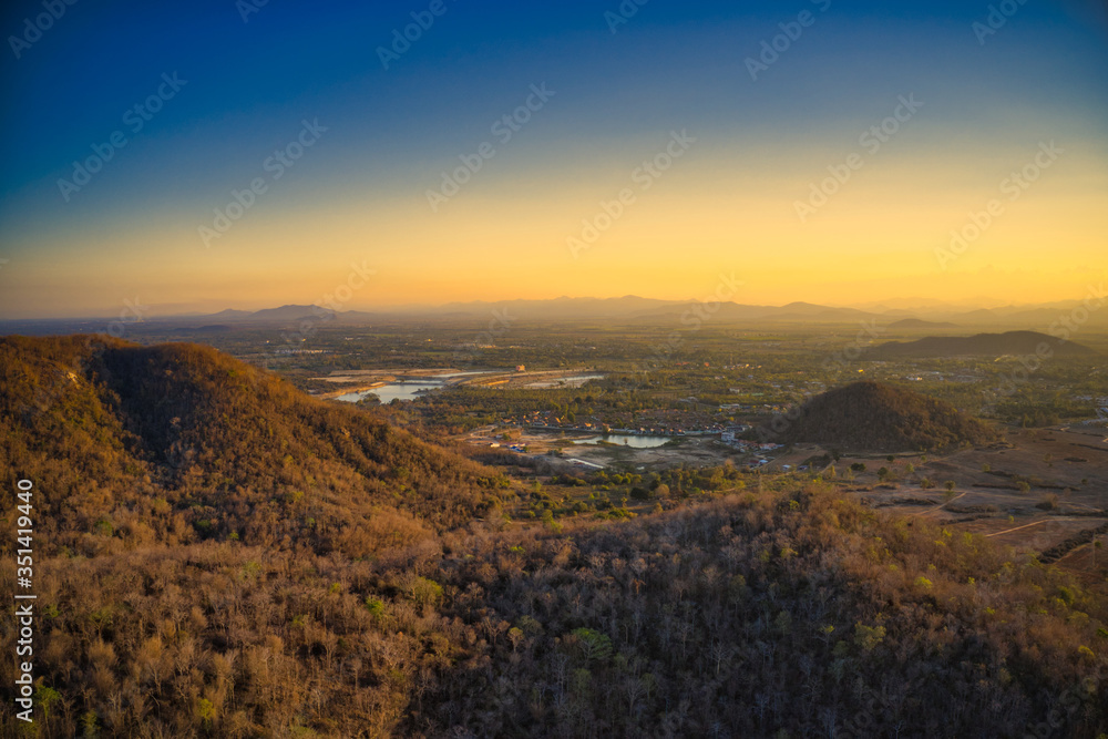 Fototapeta premium This unique photo shows the hilly landscape, from hua to thailand, taken with a drone by the evening sun during a wonderful sunset!