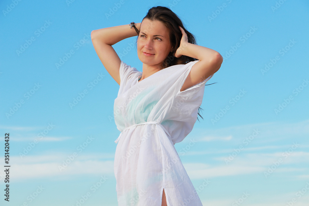 girl on a background of blue sky girl on a background of blue sky