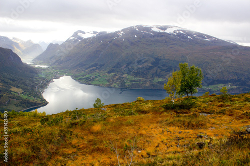 Scenic view of valley and nordfjord near Via ferrata at Loen,Norway with mountains in the background.norwegian october morning,photo of scandinavian nature for printing on calendar,wallpaper,cover photo