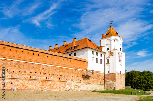 Mir, Belarus. View of a medieval castle on a background of blue sky. Summer panoramic landscape