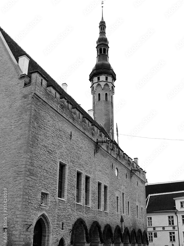 Part of an old castle with a stone wall and a tall tower in Tallinn ...