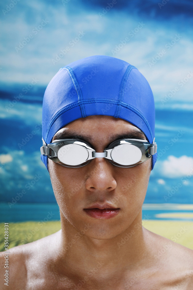 Man with swimming cap and goggles