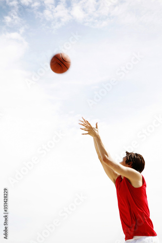Man playing basketball © ImageHit