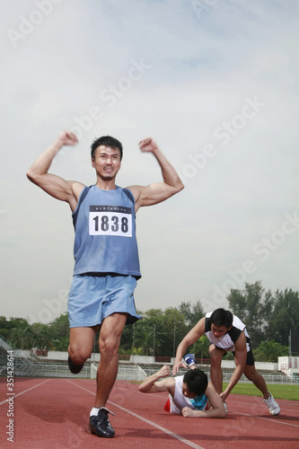 Man upon reaching finishing line