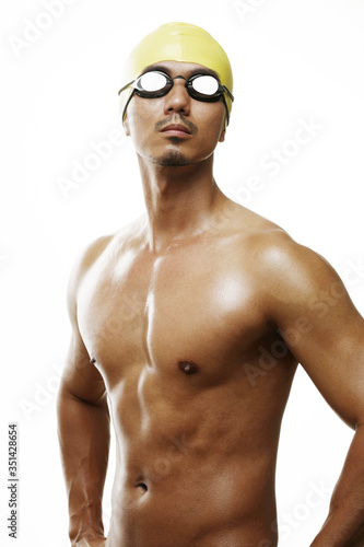 Man in swimming cap and goggles