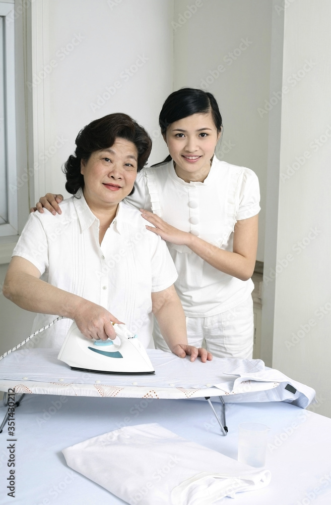 Fototapeta premium Two women ironing