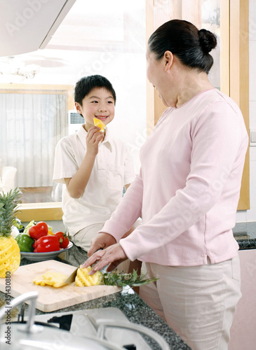 Senior woman and boy in the kitchen