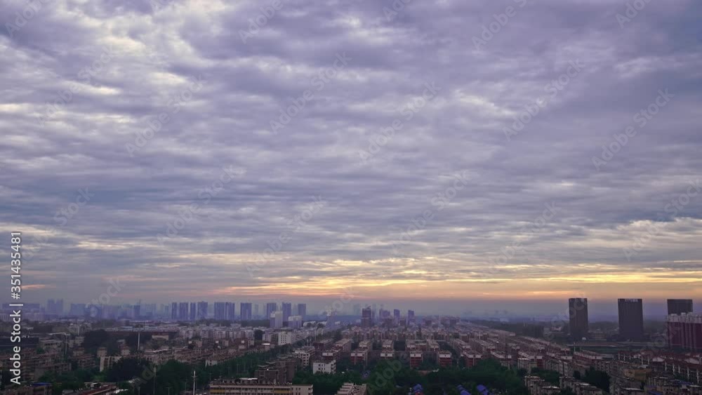 Aerial panoramic view of city and cloudy sky at sunset Aerial panoramic view of city and cloudy sky at sunset