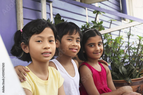 Children sitting on stairs