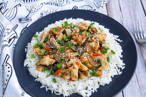 Stewed chicken with mushrooms, vegetables with herbs and rice