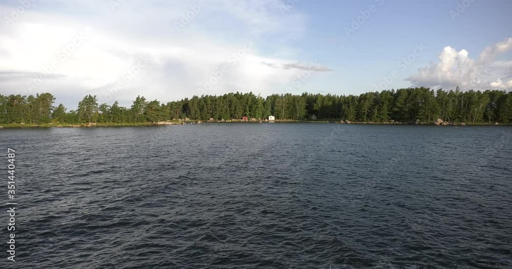 4K summer morning high quality video of Santalahti Baltic Sea Finnish Bay lagoon, pine tree forest beach with red granite boulders, lone island beach near Kotka, Finland Suomi, northern Europe 4K summer morning high quality video of Santalahti Baltic Sea Finnish Bay lagoon, pine tree forest beach with red granite boulders, lone island beach near Kotka, Finland Suomi, northern Europe