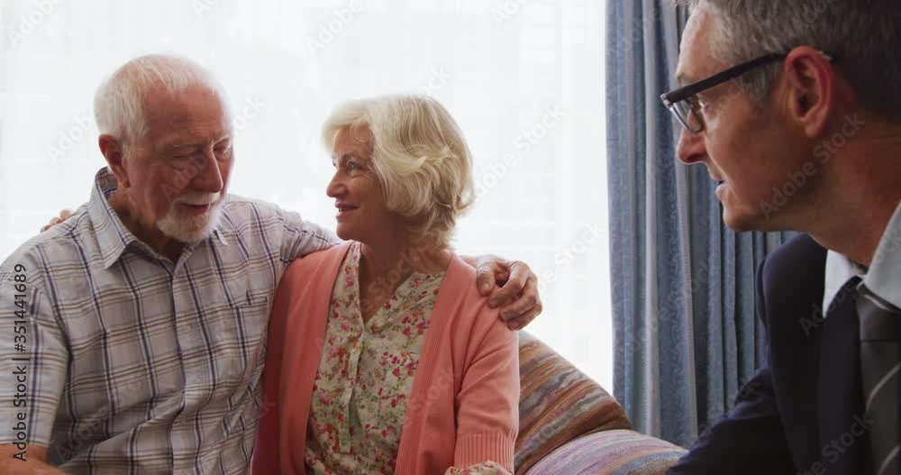 Senior couple talking with a business man in retirement house Senior couple talking with a business man in retirement house