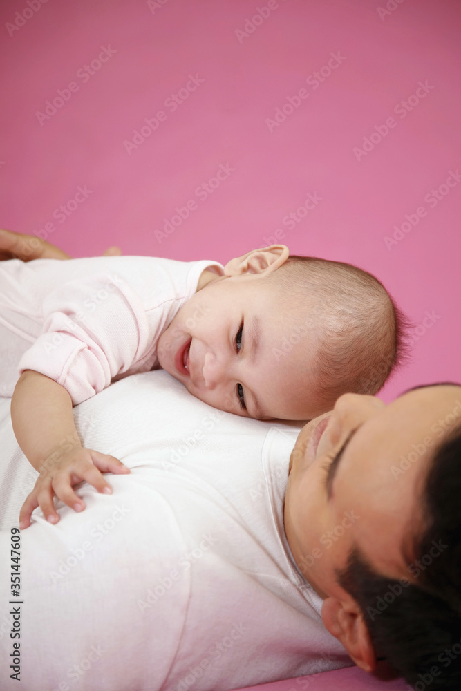 Baby resting on man's chest Baby resting on man's chest
