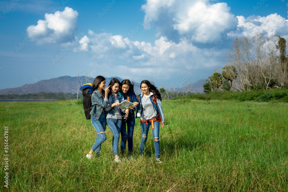 A happy group of tourists having fun travel in nature and meadow. A happy group of tourists having fun travel in nature and meadow.