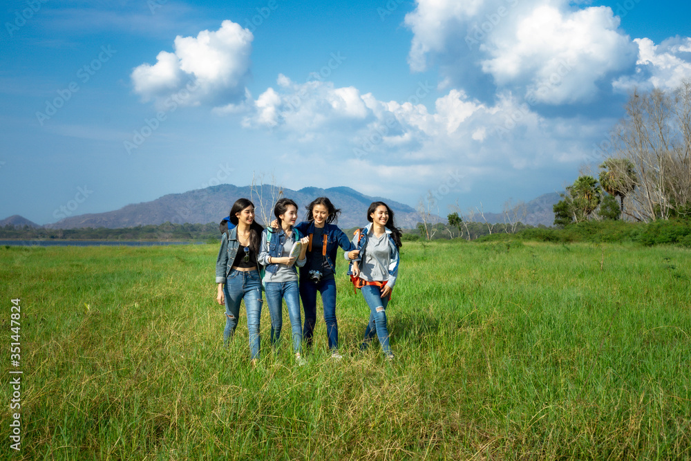 A happy group of tourists having fun travel in nature and meadow. A happy group of tourists having fun travel in nature and meadow.