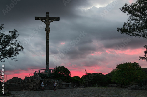 SUNSET KNELLING ON YOUR CROSS photo