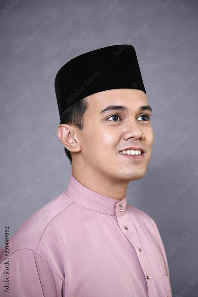 Man with songkok looking away Man with songkok looking away
