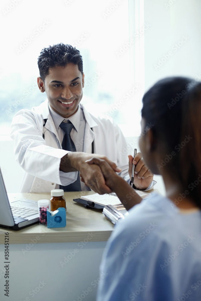 Doctor shaking hands with patient Doctor shaking hands with patient