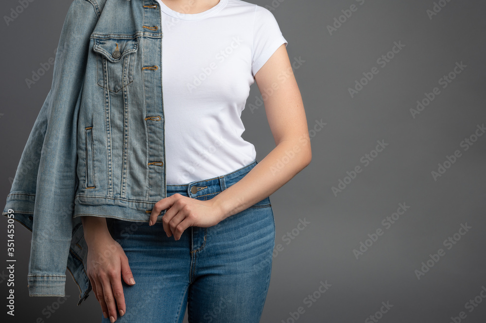 Mockup T-shirt Woman with a denim jacket and blue jeans, hipster, on a