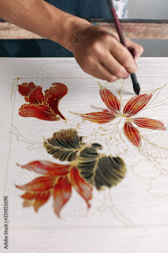 Obraz na płótnie Man painting batik fabric