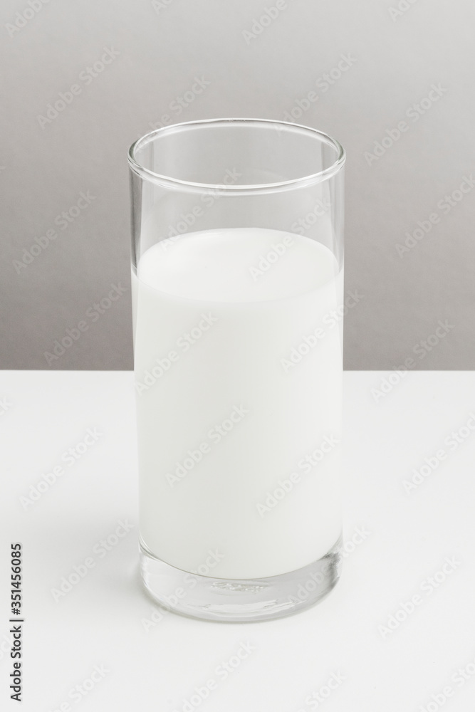 Fresh milk in a glass on a table Fresh milk in a glass on a table