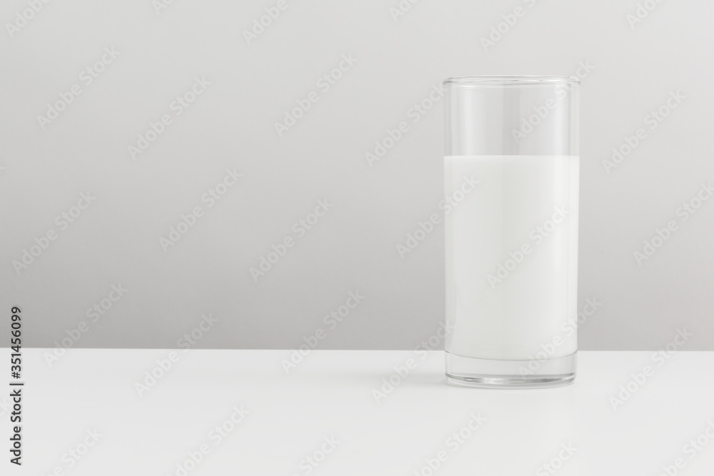 Fresh milk in a glass on a table banner Fresh milk in a glass on a table banner