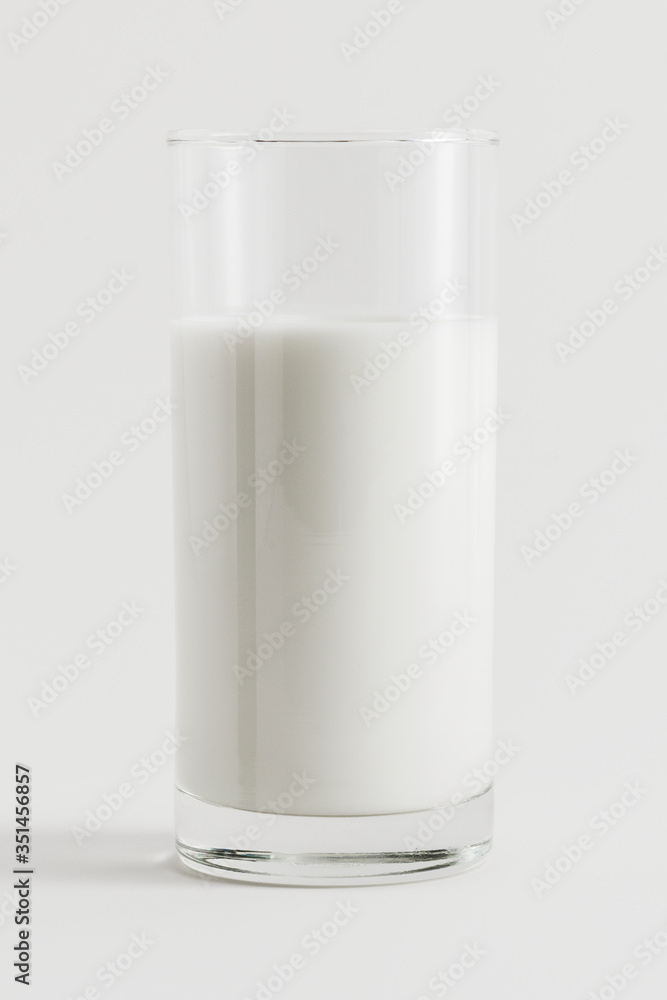 Fresh milk in a glass on white background Fresh milk in a glass on white background