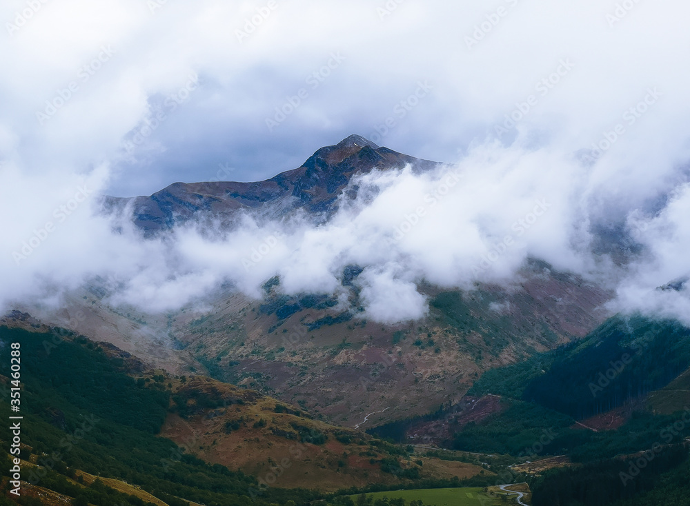 Scottish mountains with clouds. 
the picture was taken while climbing to the highest scottish peak - Ben Nevis