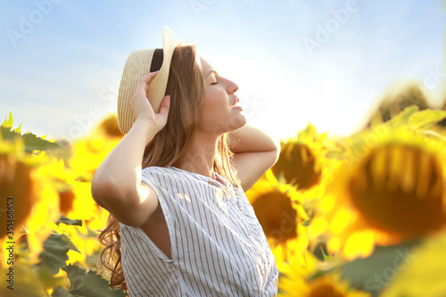 Beautiful young woman in su...