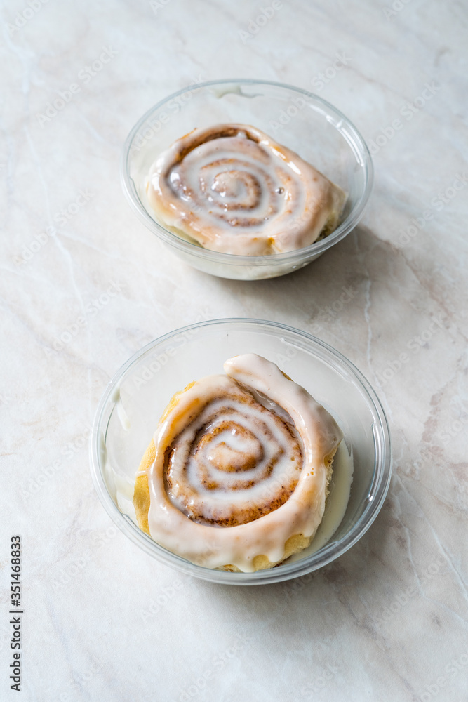 Take Away Cinnamon Roll / Cinnamon Bun with Cream in Plastic Box Package Container for Sale. Ready to Eat Take Away Cinnamon Roll / Cinnamon Bun with Cream in Plastic Box Package Container for Sale. Ready to Eat