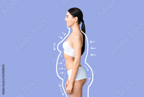 Young woman after weight loss on color background photo