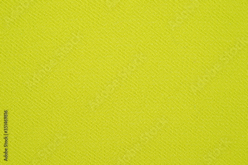A fragment of a light green chiffon photographed in close-up.