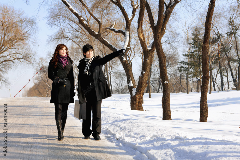 Business people walking on snowy road Business people walking on snowy road