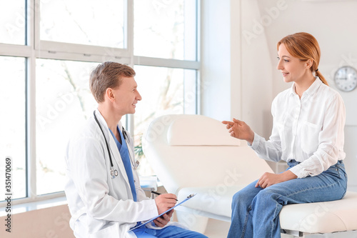 Woman visiting plastic surgeon in clinic