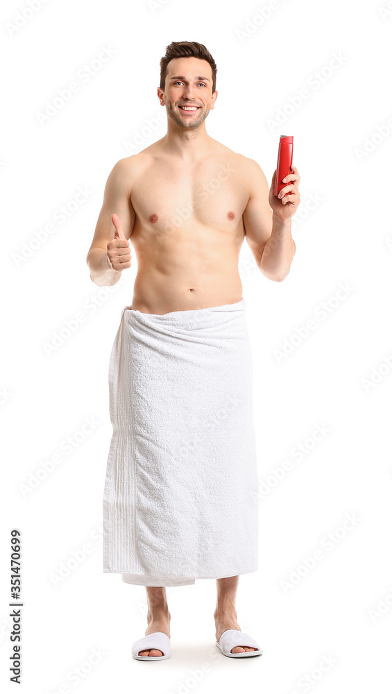 Fototapeta premium Handsome man with shower gel on white background