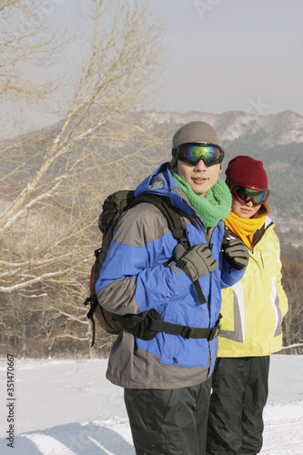 Man and woman with ski goggles