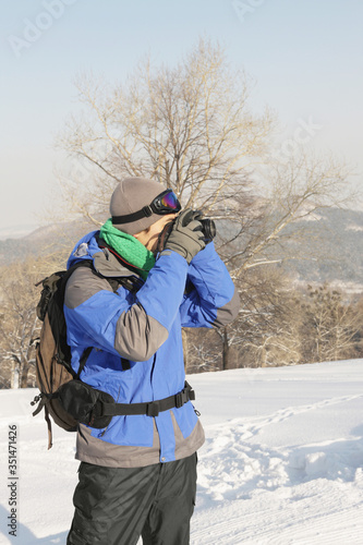 Man taking picture on winter day