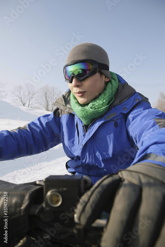 Man riding on snowmobile