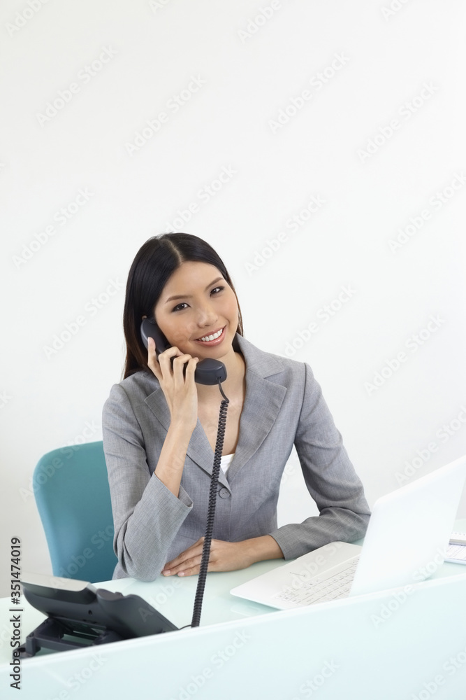 Businesswoman talking on the phone Businesswoman talking on the phone